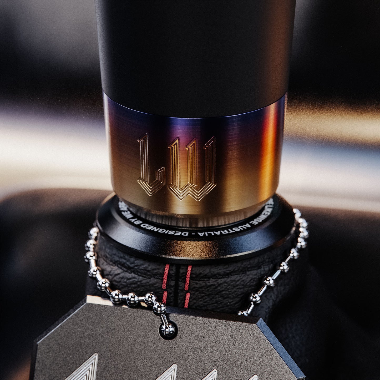 Close-up of a Likewise gear shifter with brand logo on a blurred background